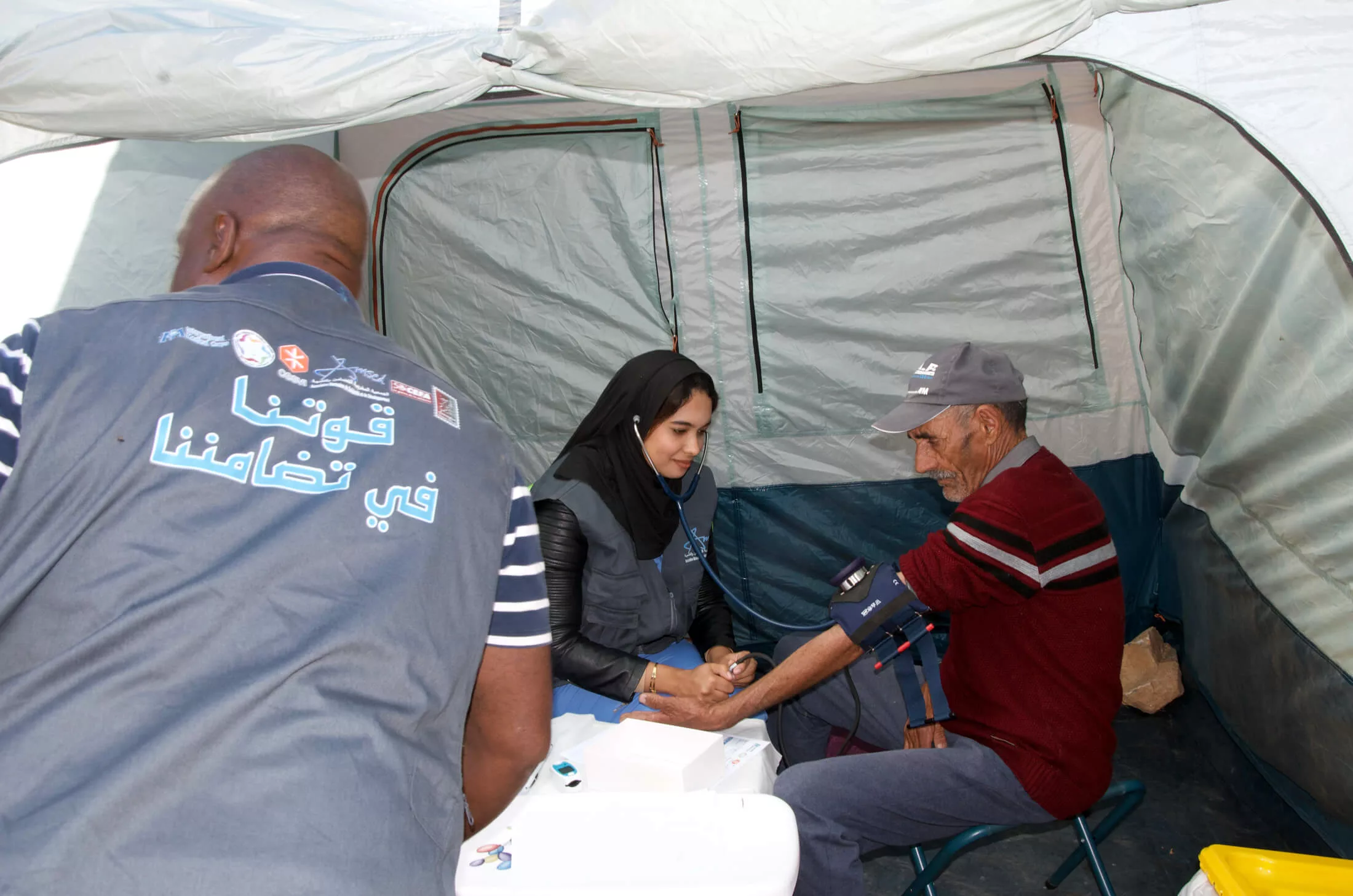 Staff members deliver vital medications and provide routine blood pressure checks on people affected by the earthquakes.