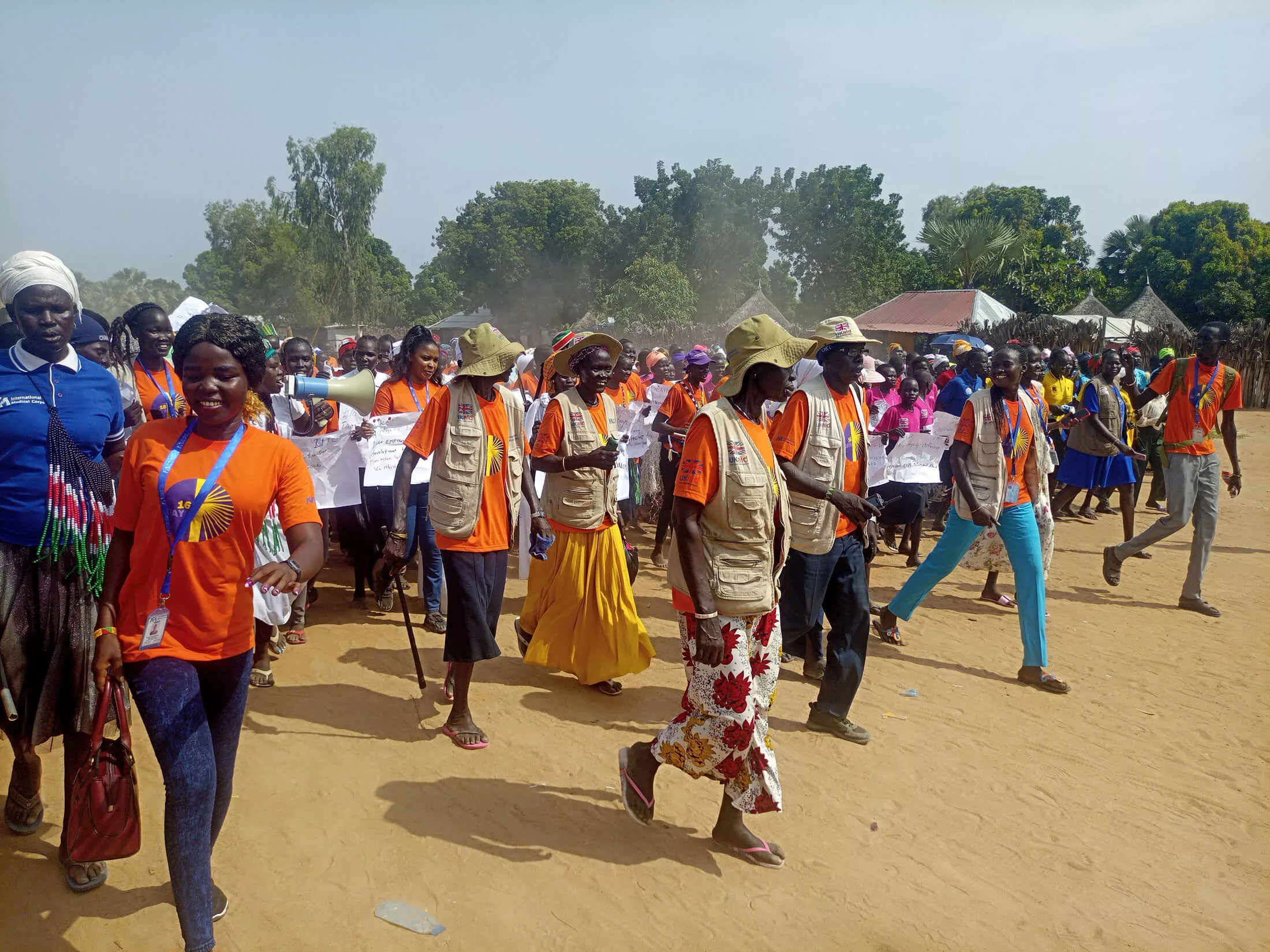 Humanitarian staff and community members march to commemorate the beginning of the 16 Days campaign.