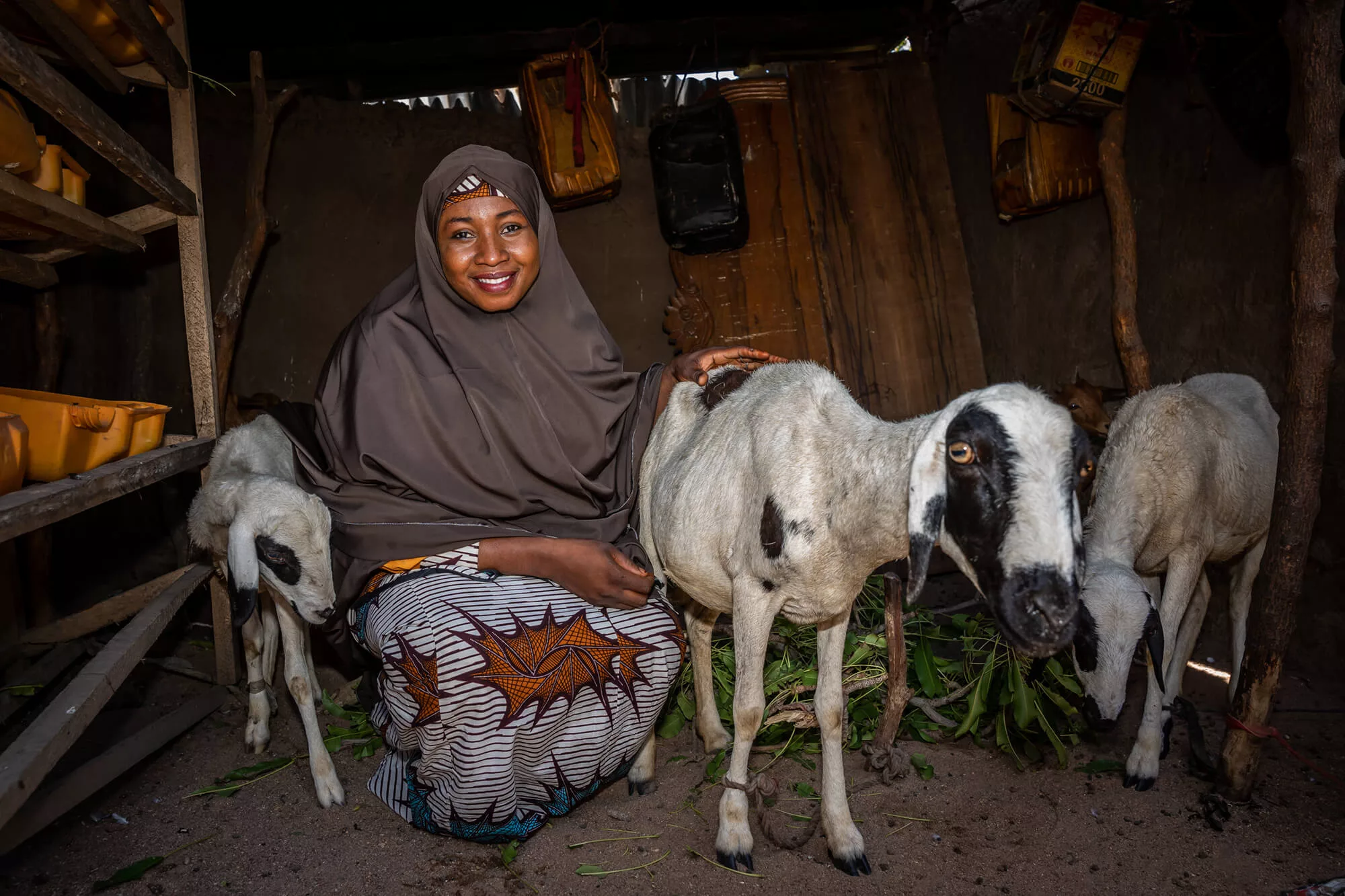 Asmau Sambo rests at home with her goats