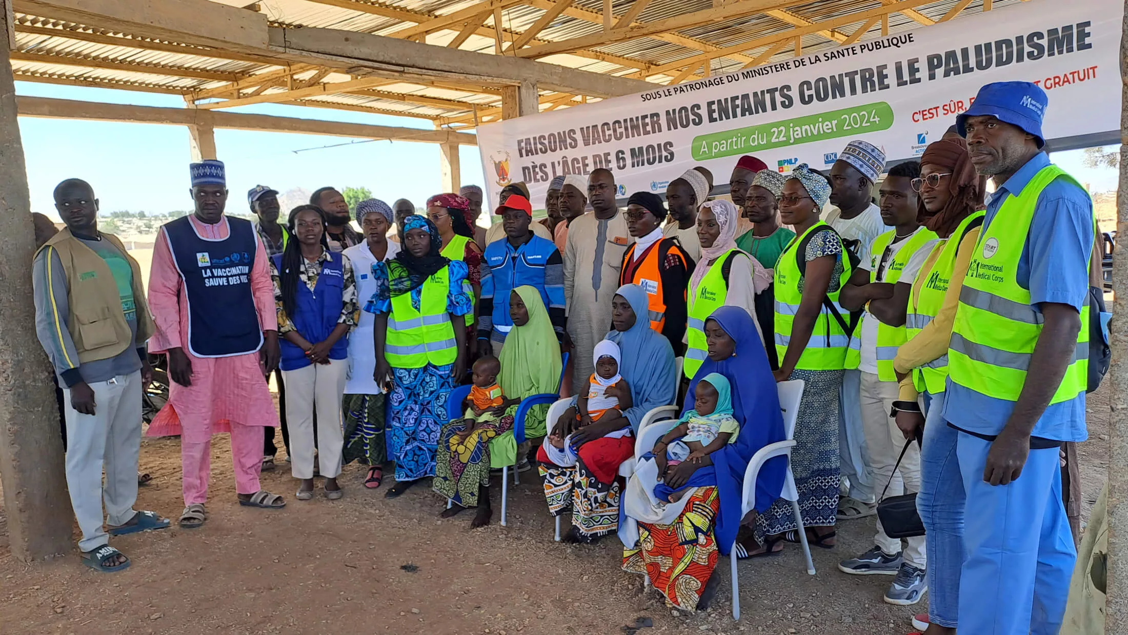 International Medical Corps staff and families from the community gather at the launch of Cameroon’s first malaria vaccine campaign.
