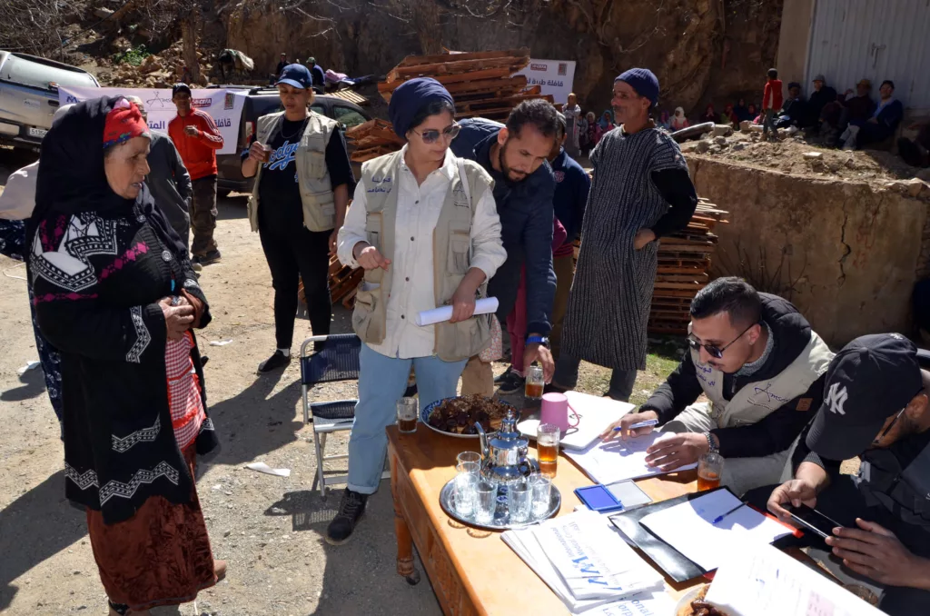 International Medical Corps and AMSED staff members register people to receive essential non-food items, including winterization kits and hygiene kits, in the Ouneine region of Taroudant province.