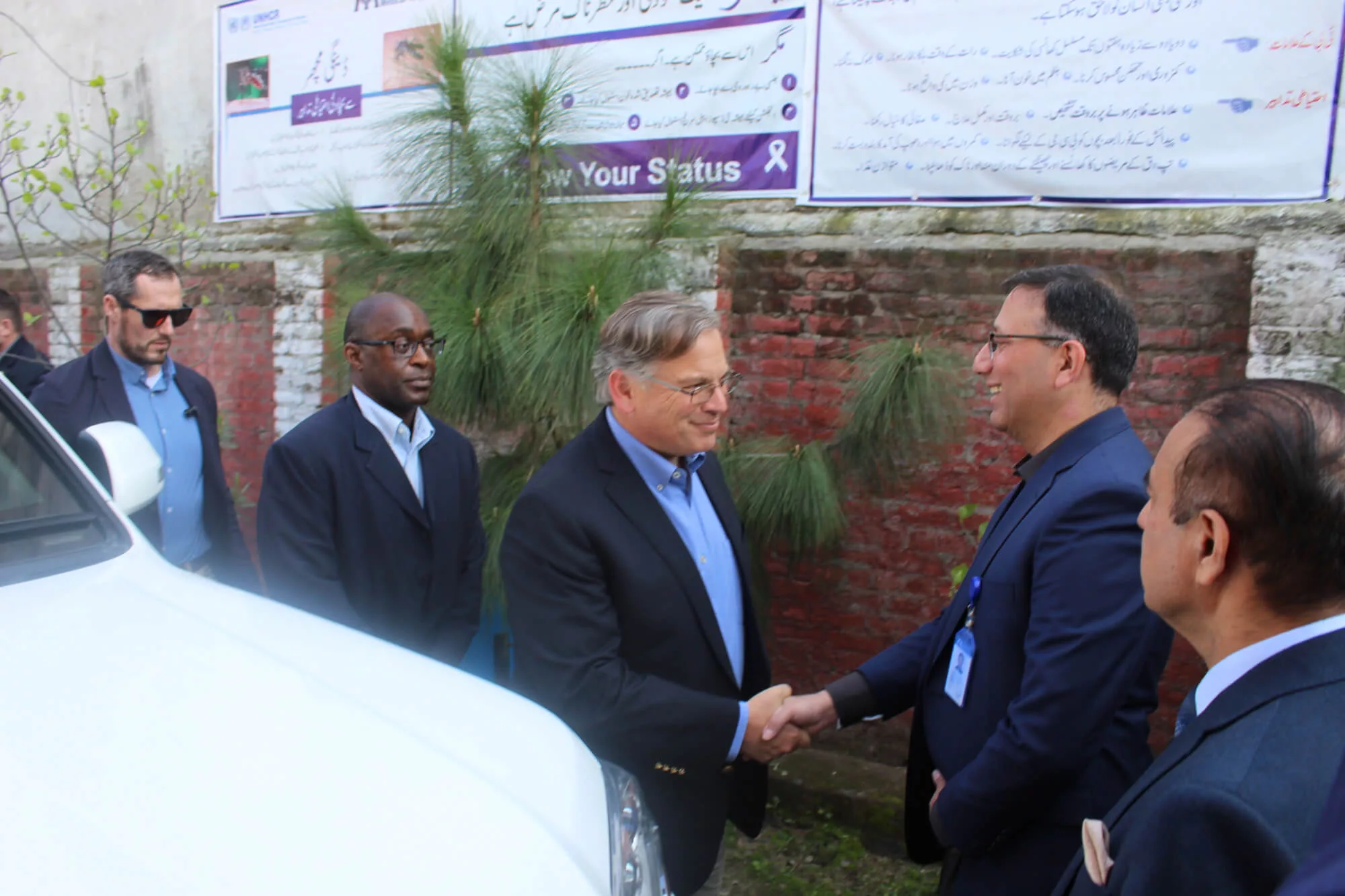Ambassador Donald Blome greets our Pakistan Country Director Bakhitar Ahmed.