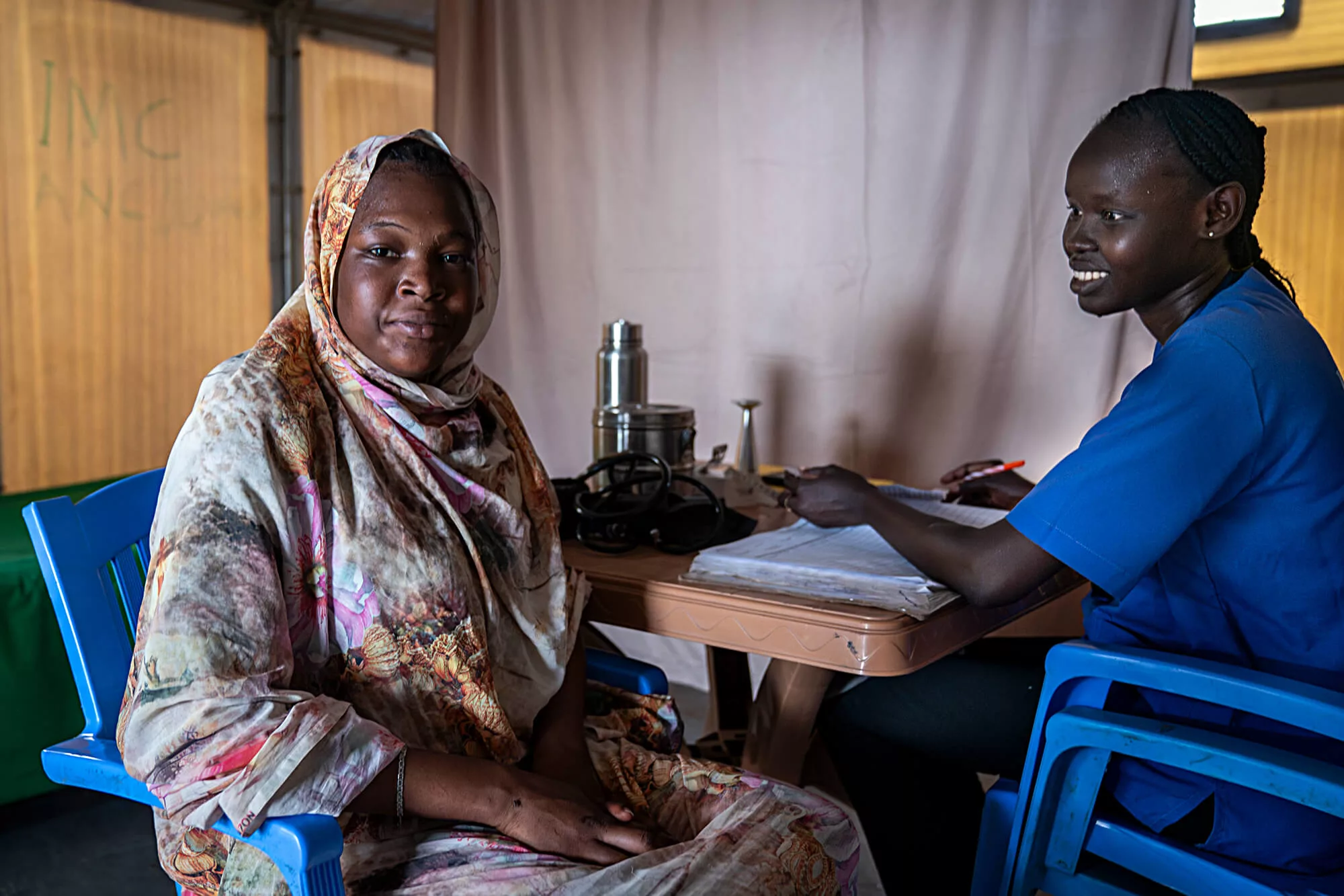 Midwife Nyapin Chol Put conducts a prenatal checkup with a patient at the health clinic in Renk, South Sudan.
