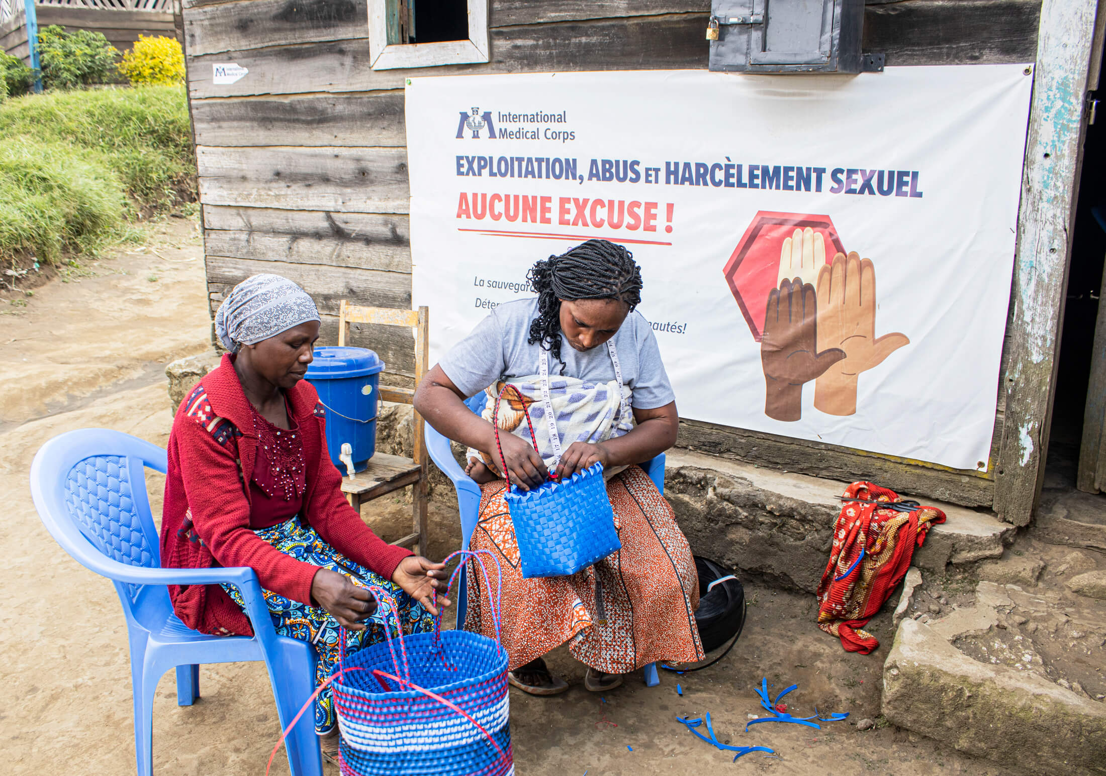 Florence Uzamukunda weaves a basket with a woman from Kashebere health area.