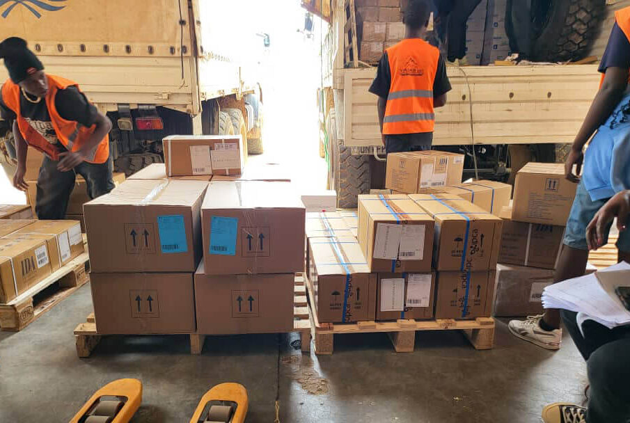 Workers unload PPE supplies in Bunia.